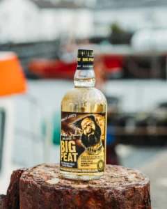 Big Peat islay blended malt whiskey on rock imported in india by Solis Group.
