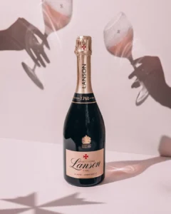 Lanson Le Rose Nv Champagne with wine glass in shadow