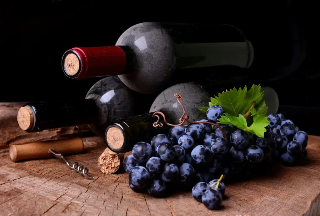 portwine with grapes on table