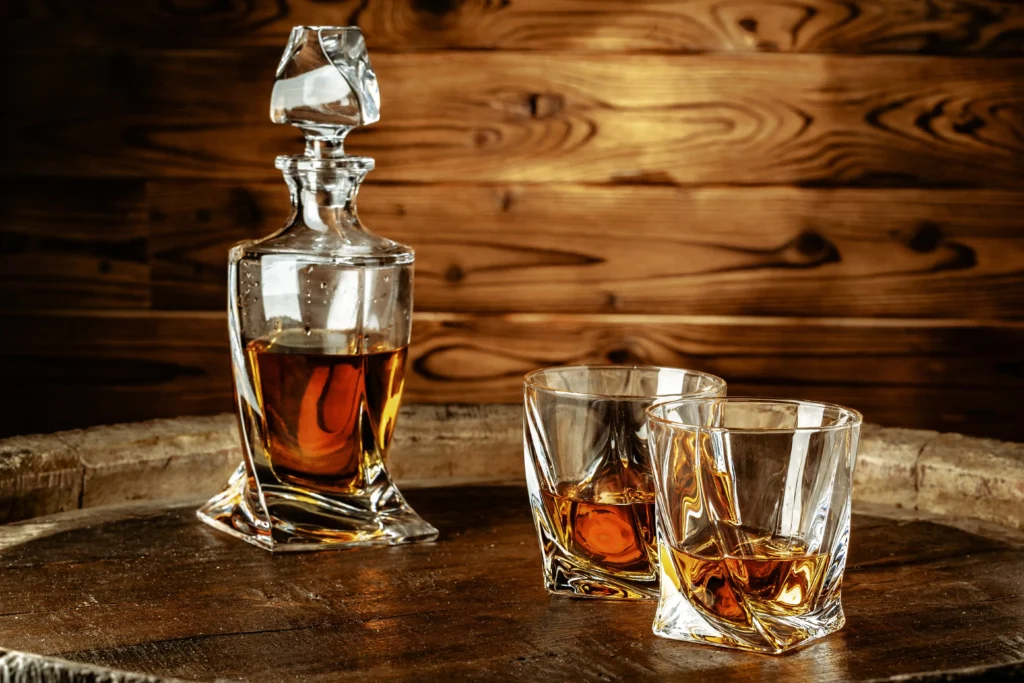 two glasses with cognac bottle