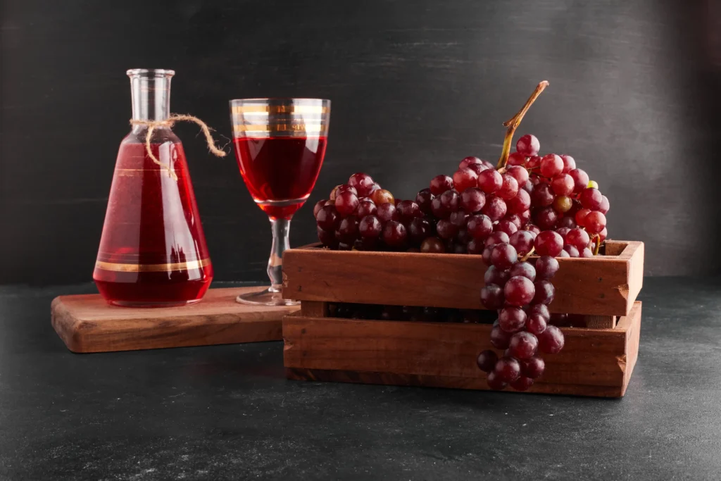 red wines grapes with wine glass