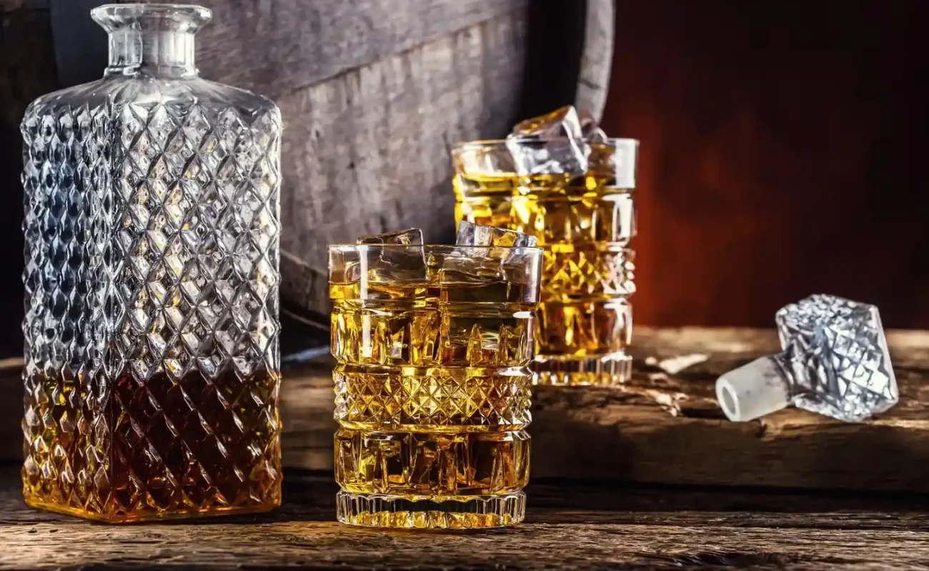 two-cups-full-beverage-whiskey-with-ice-cubes-retro-style