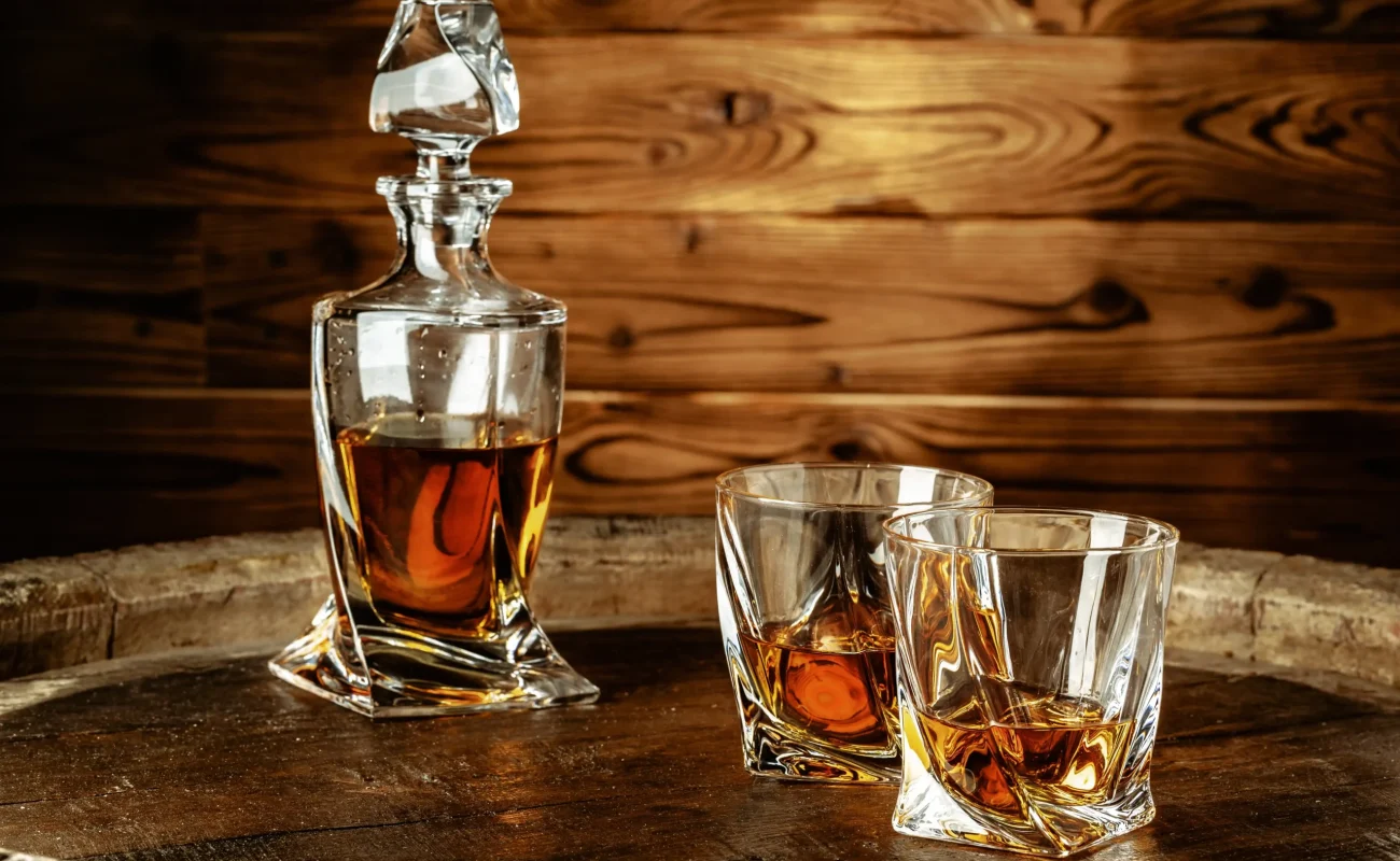 two glasses with cognac bottle